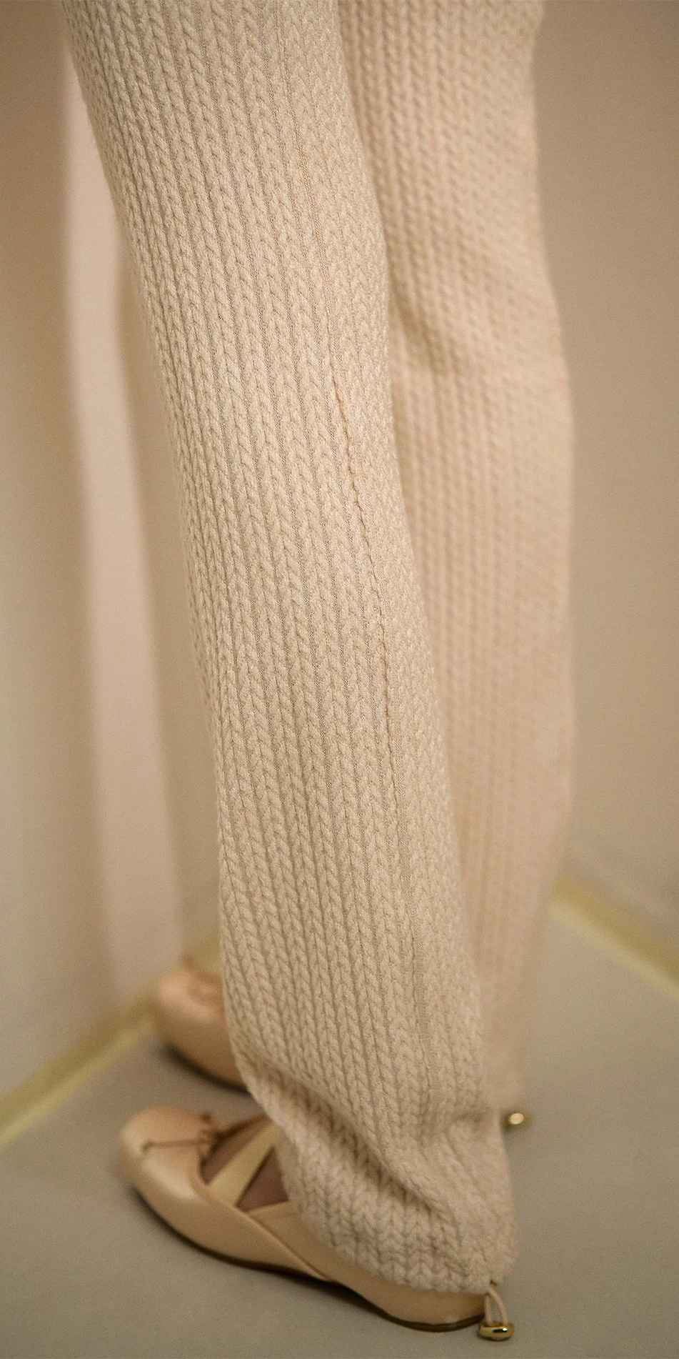 Knitted leg warmers in cream back detail