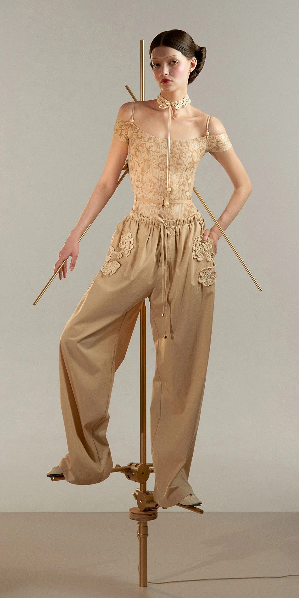 Cotton baggy pants crochet details in beige front view on
