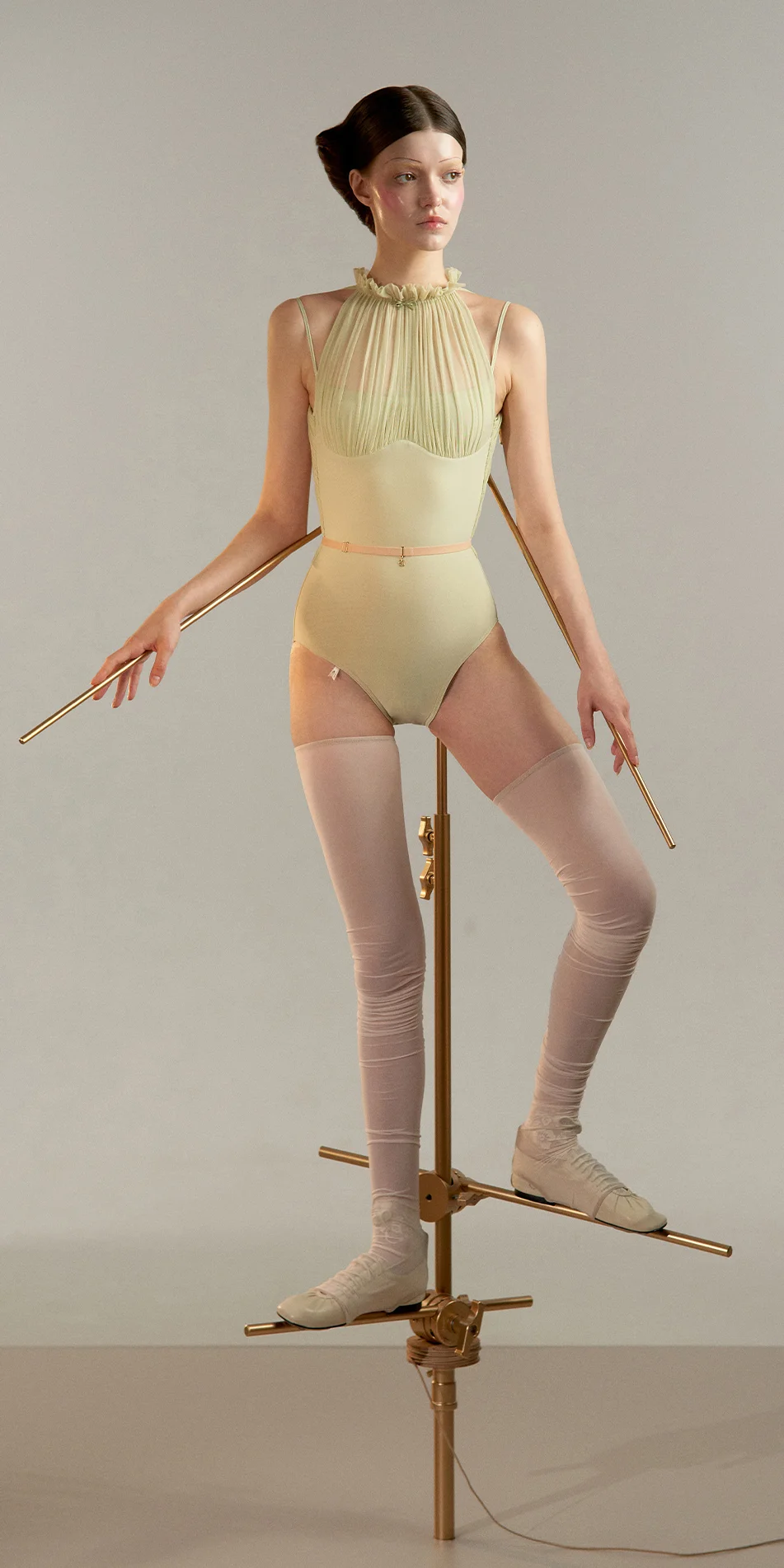 Draped mockneck leotard in green tea shade front view on