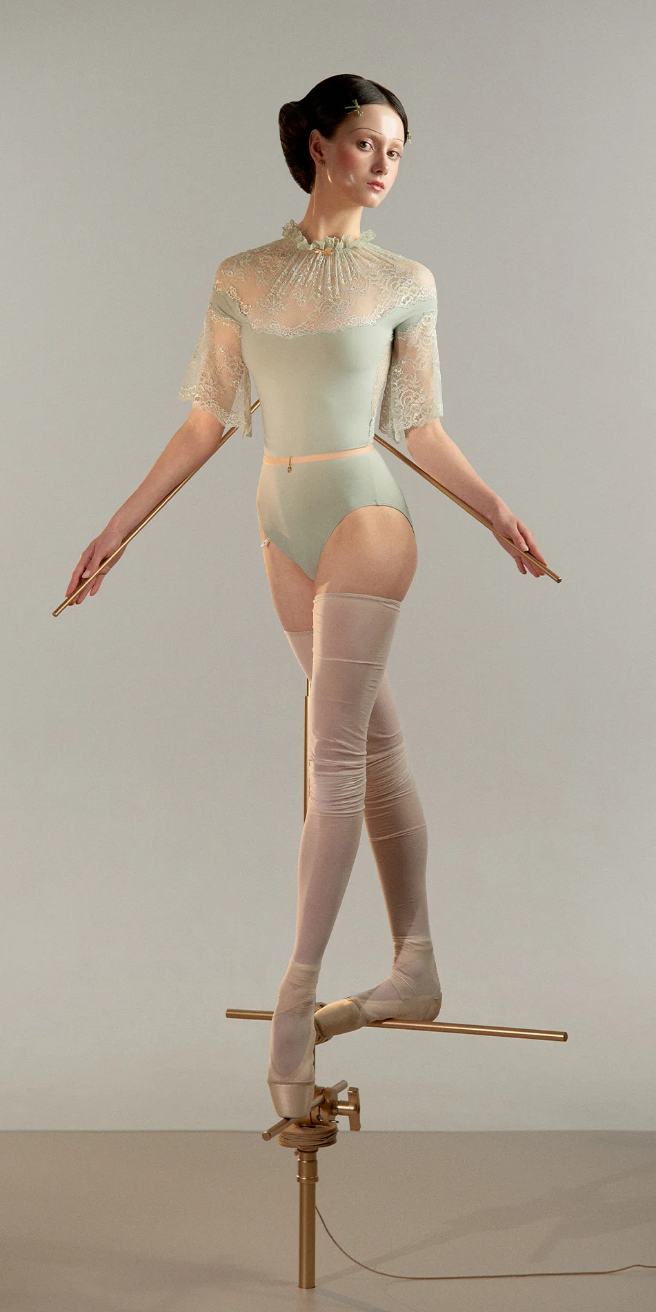 Mockneck leotard with bell sleeves in sage green front view on