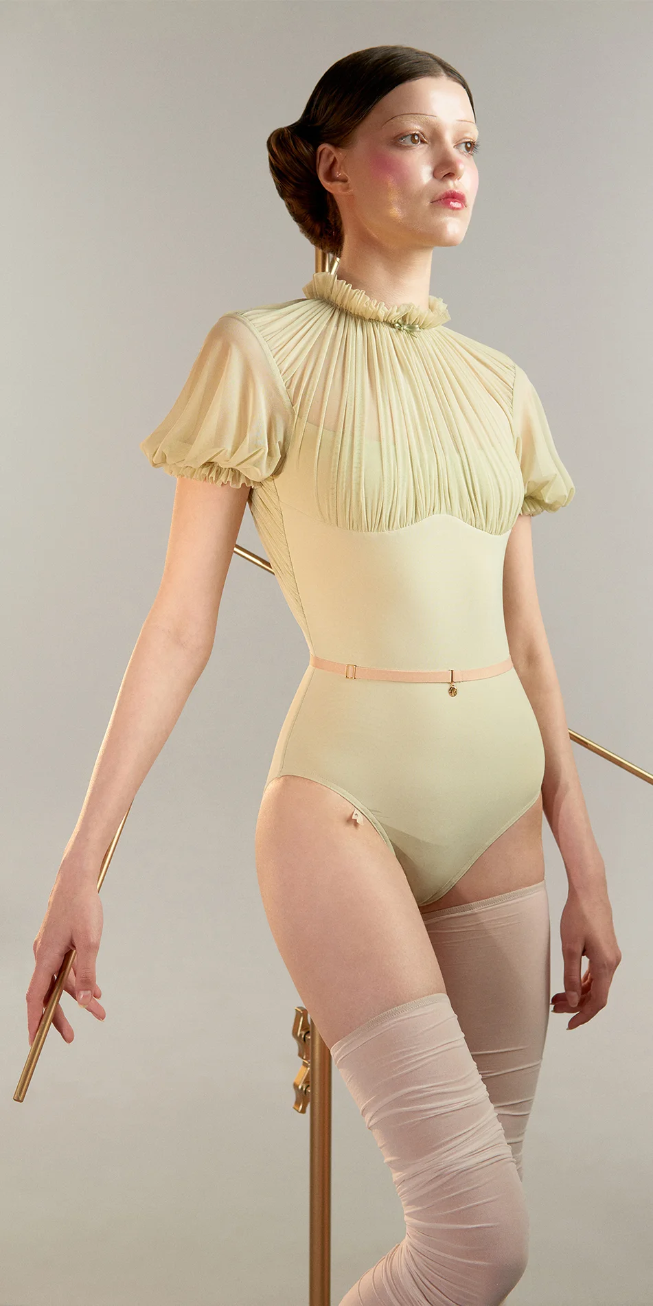 Mockneck leotard with puff sleeves green tea cropped side view on