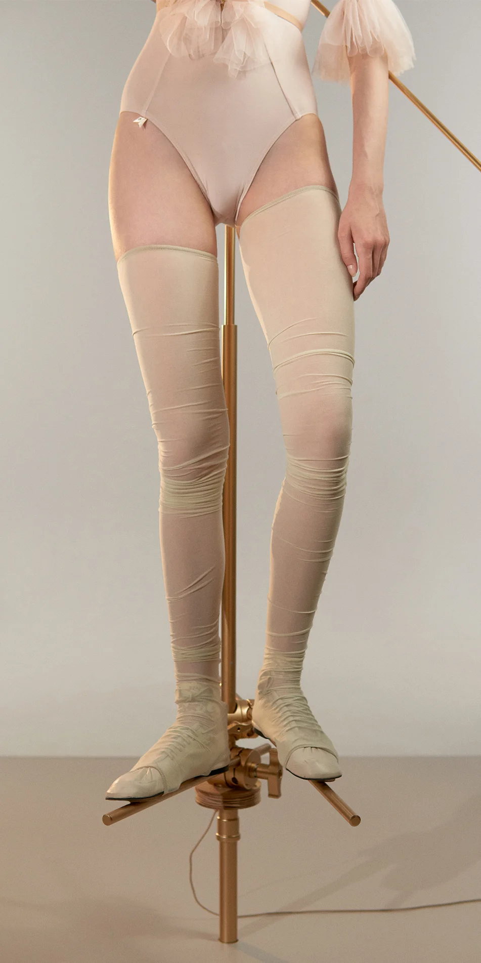 Sheer thigh high stockings in green tea shade cropped front view on