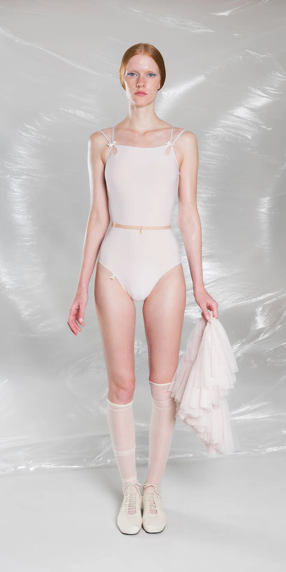Classic cross back leotard in pearl pink front view arm