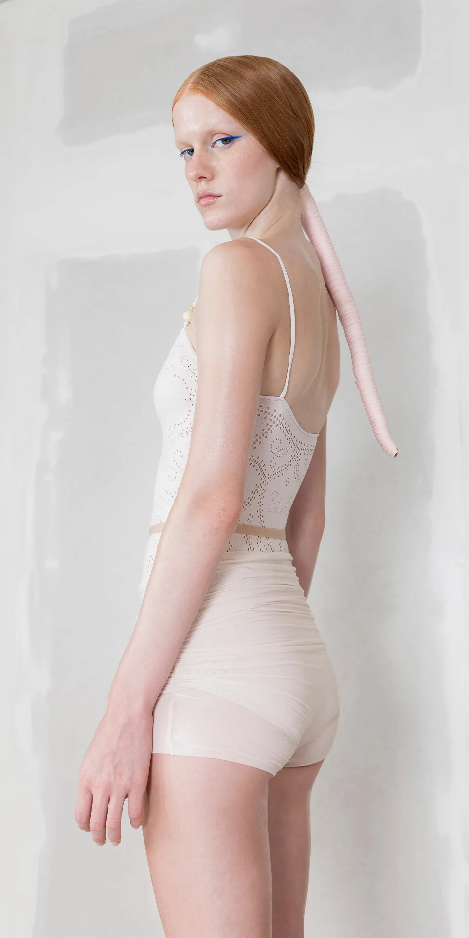 Sheer wrap shorts in pearl pink side view look back