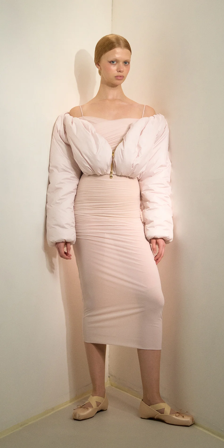 Cropped boatneck puffer jacket in soft pink front arms down on