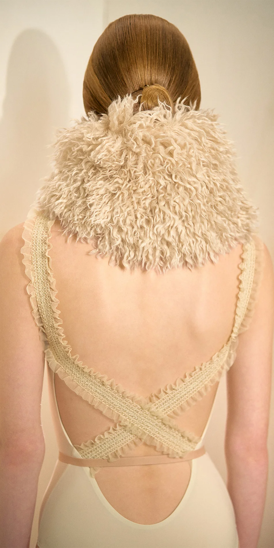 Faux fur hat neck warmer light beige back close up with crossback leotard
