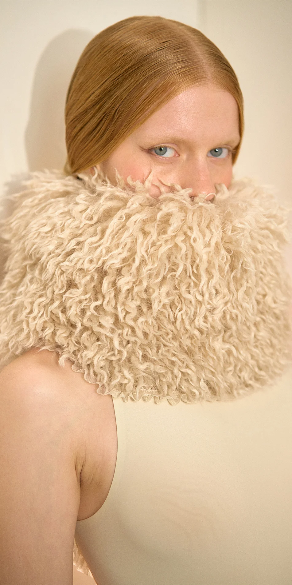 Faux fur hat neck warmer light beige side close up of face with model gaze