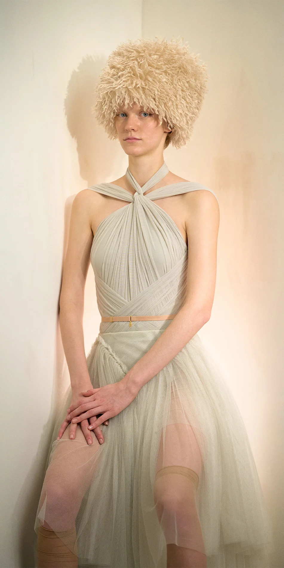 Faux fur hat neck warmer light beige sitting posing on