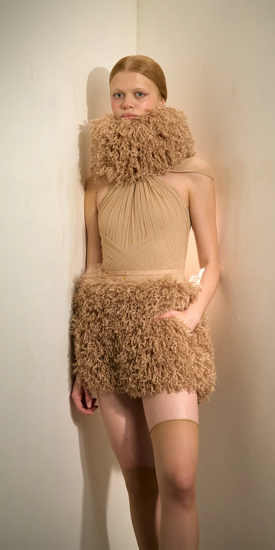 Faux fur hat neck warmer nude hand in pocket on