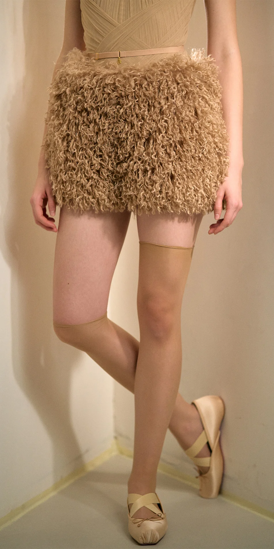 Faux fur shorts nude front one leg back