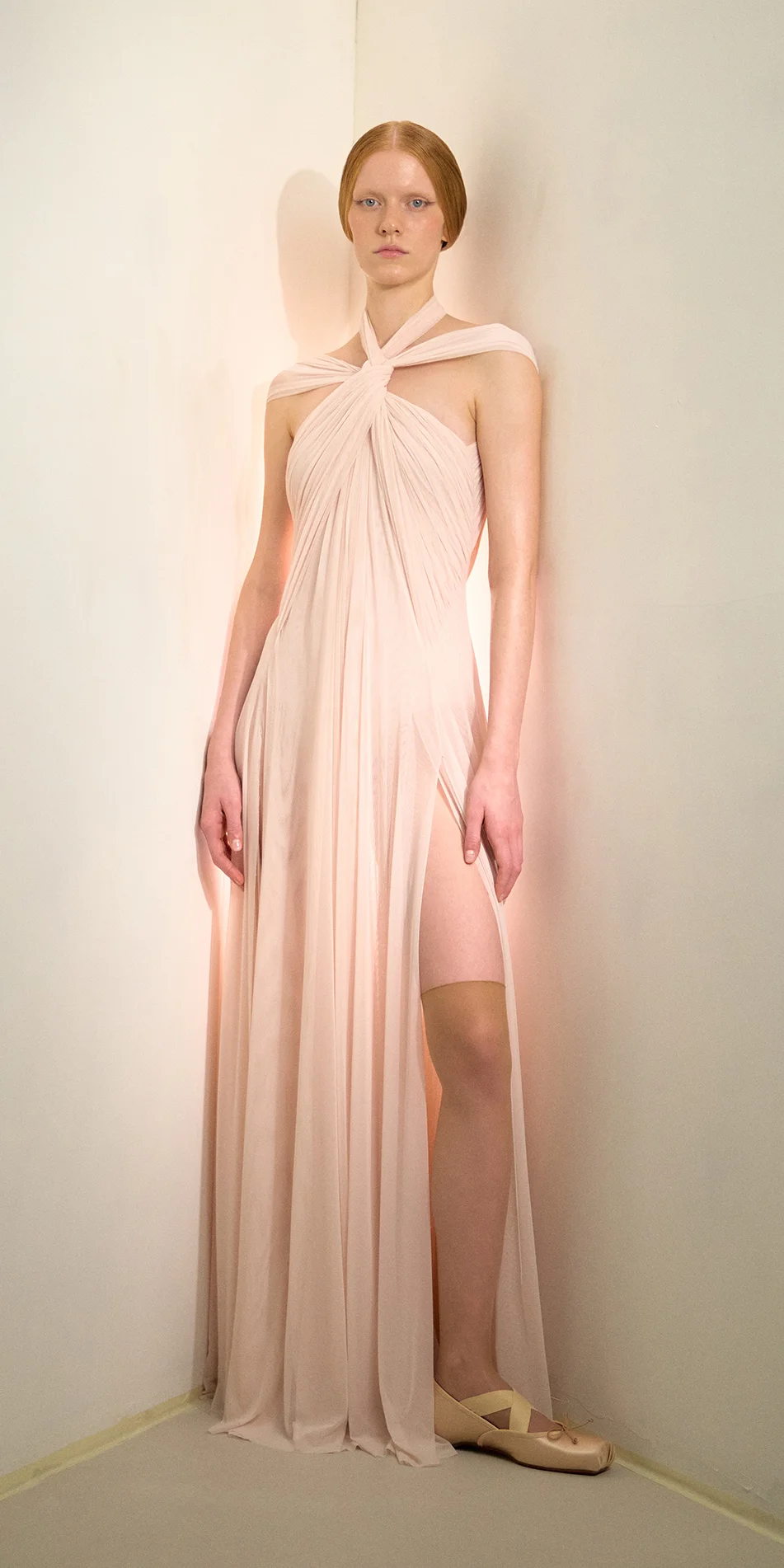 Knotted halter maxi dress in soft pink front view on