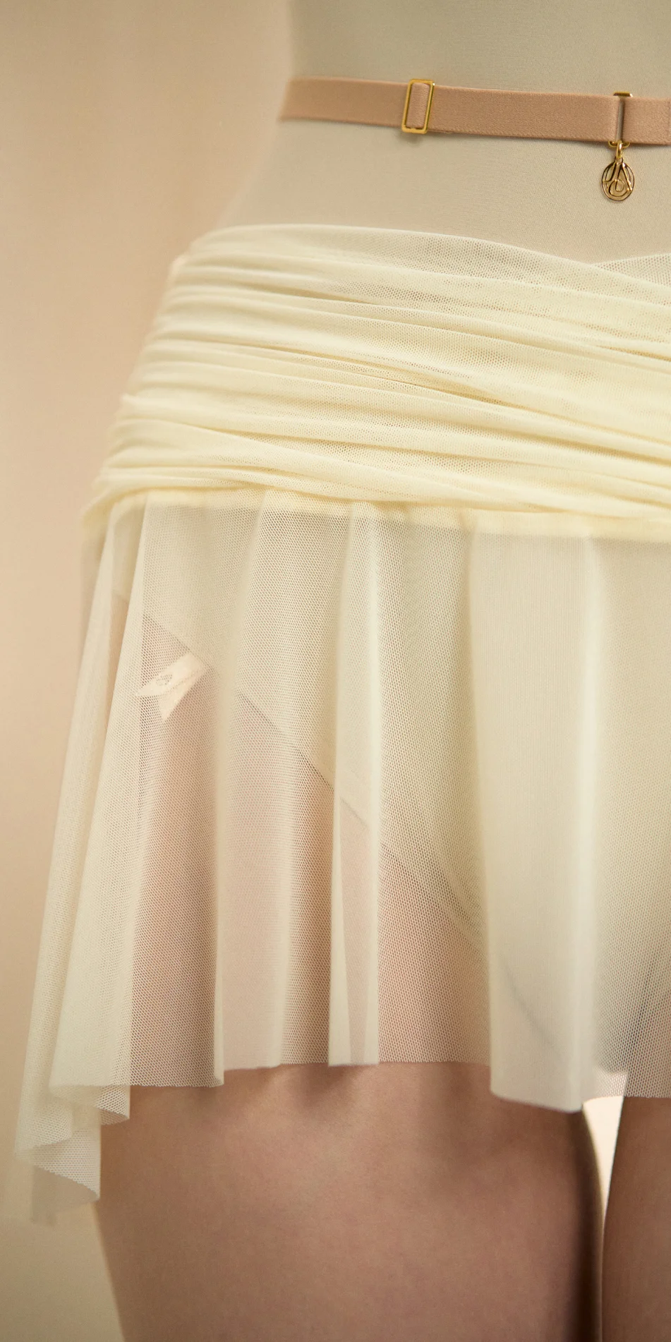 Mesh mini skirt in cream front detail