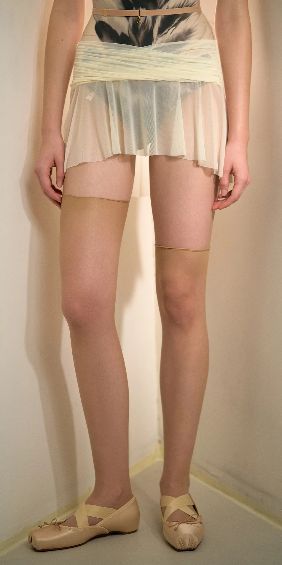 Mesh mini skirt in cream front legs cropped shot