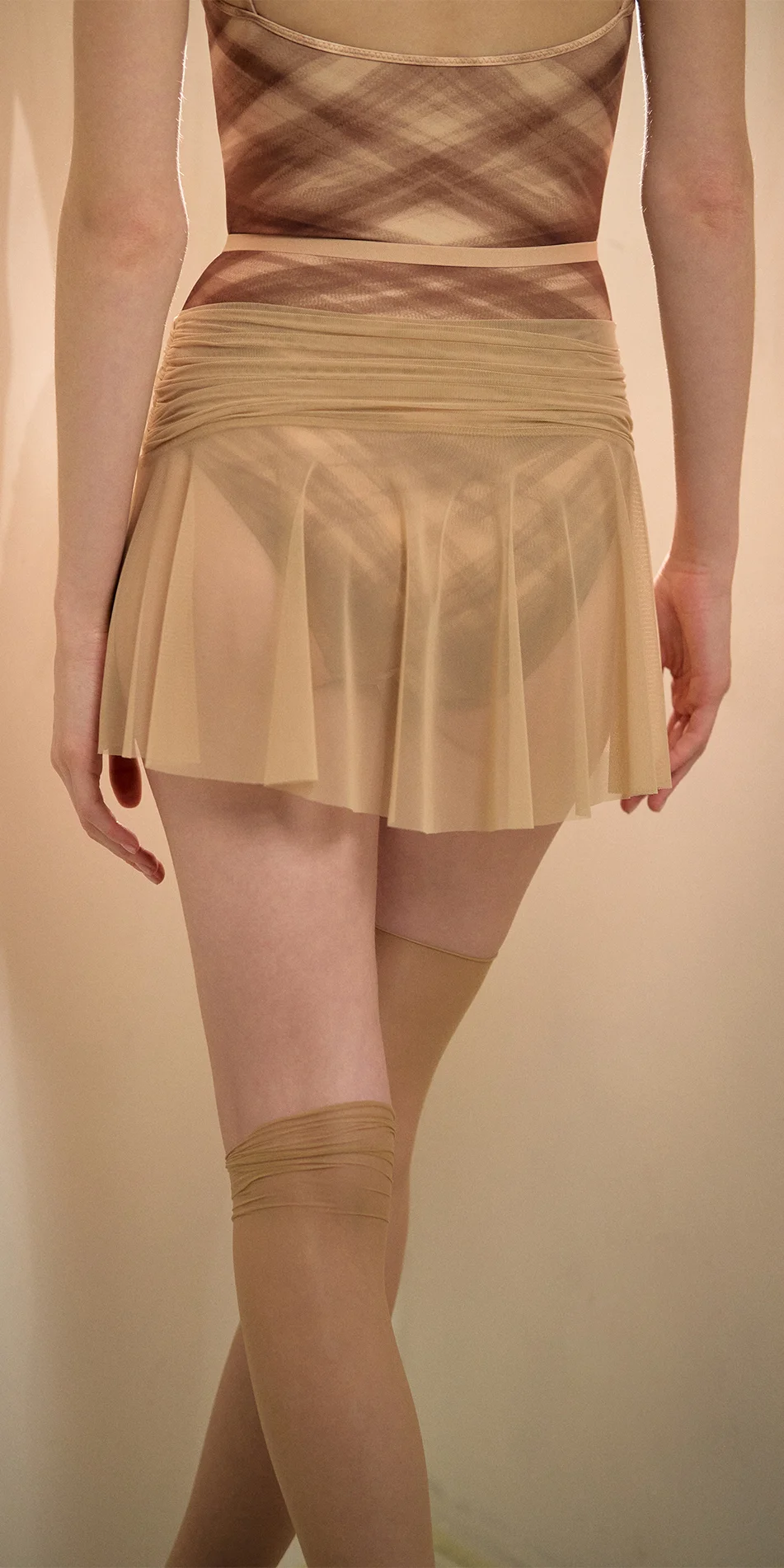 Mesh mini skirt in light beige back view
