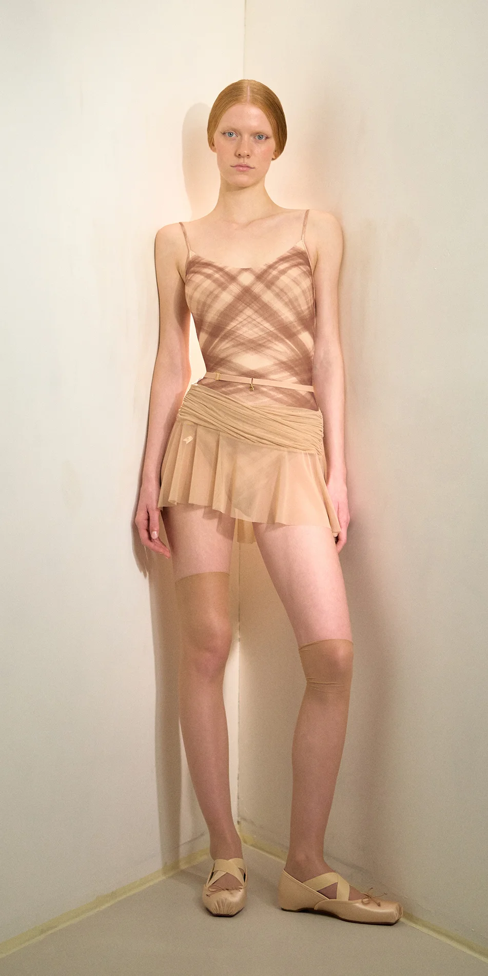 Mesh mini skirt in light beige front view on