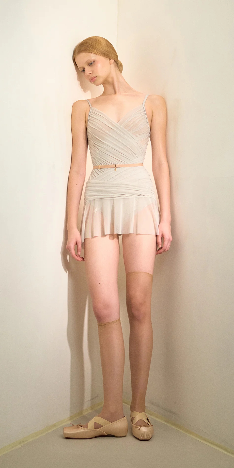 Mesh mini skirt in sage green front view on