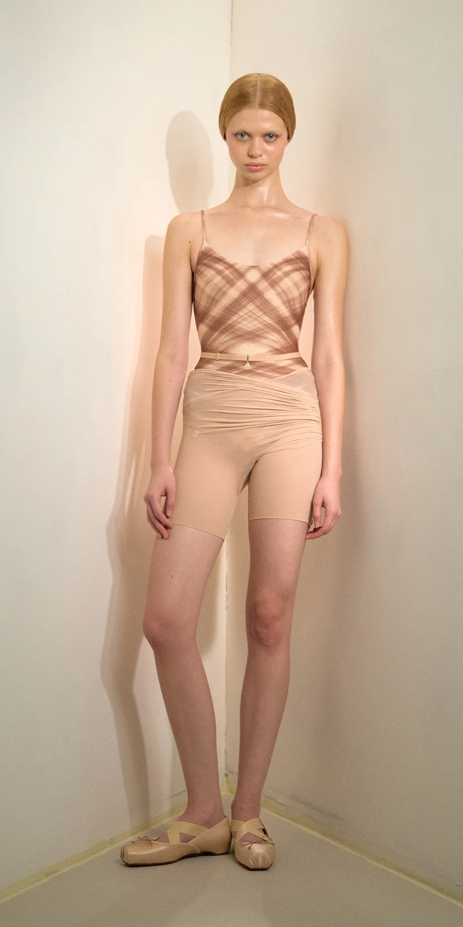 Sheer bike shorts in light beige front view on