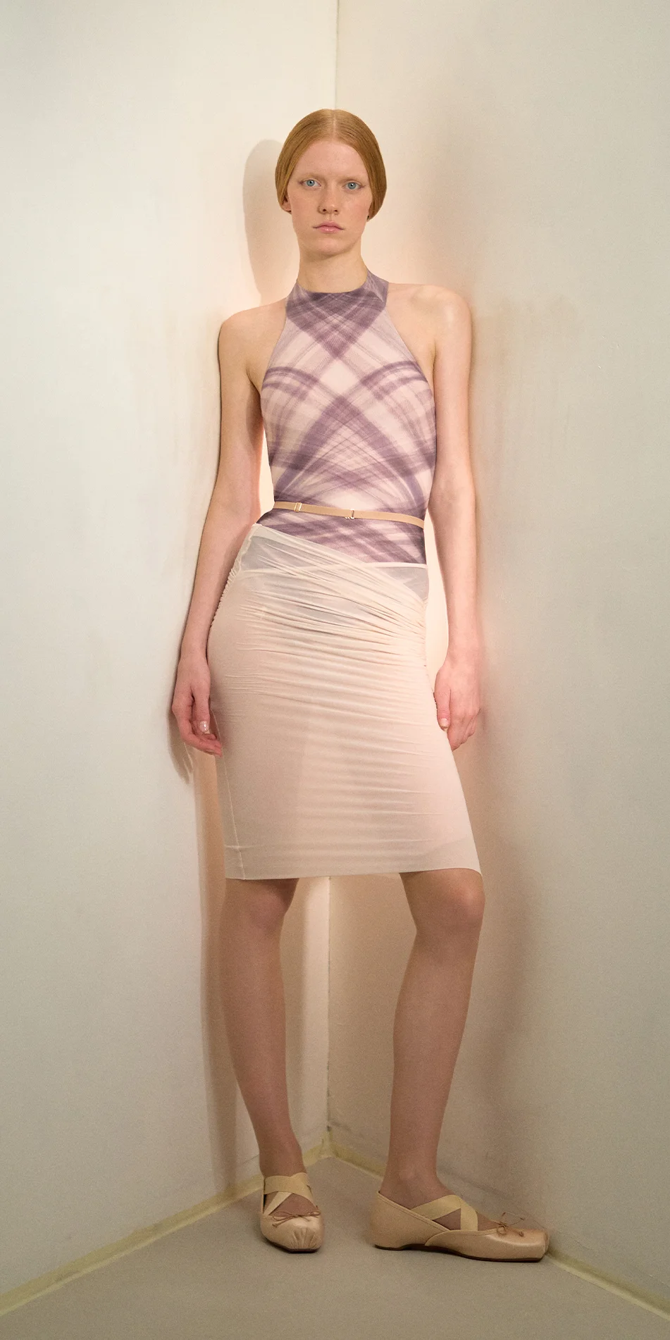Sheer pencil skirt in soft pink front view on