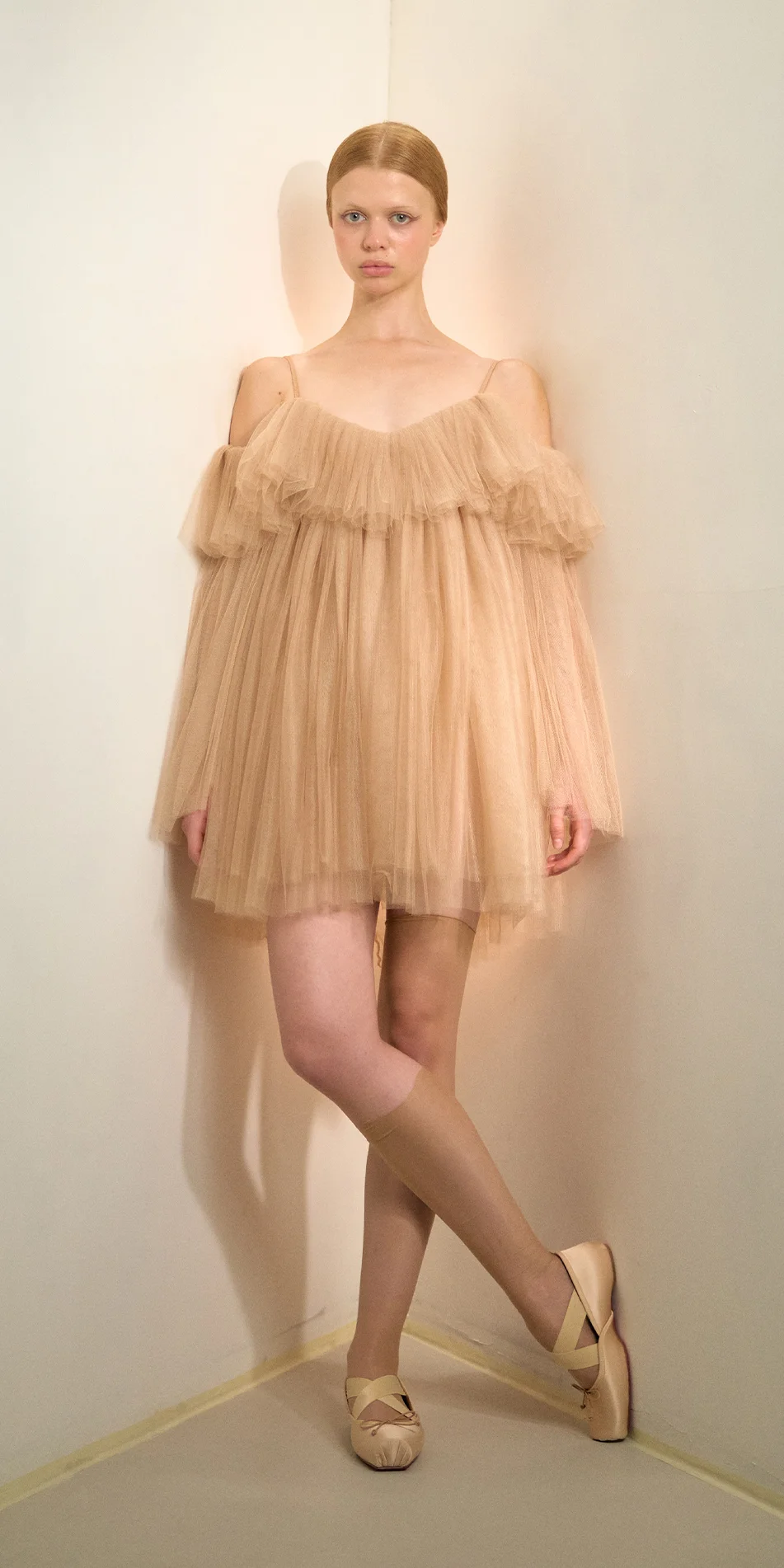 Tulle babydoll dress angel sleeves in light beige front crossed legs on