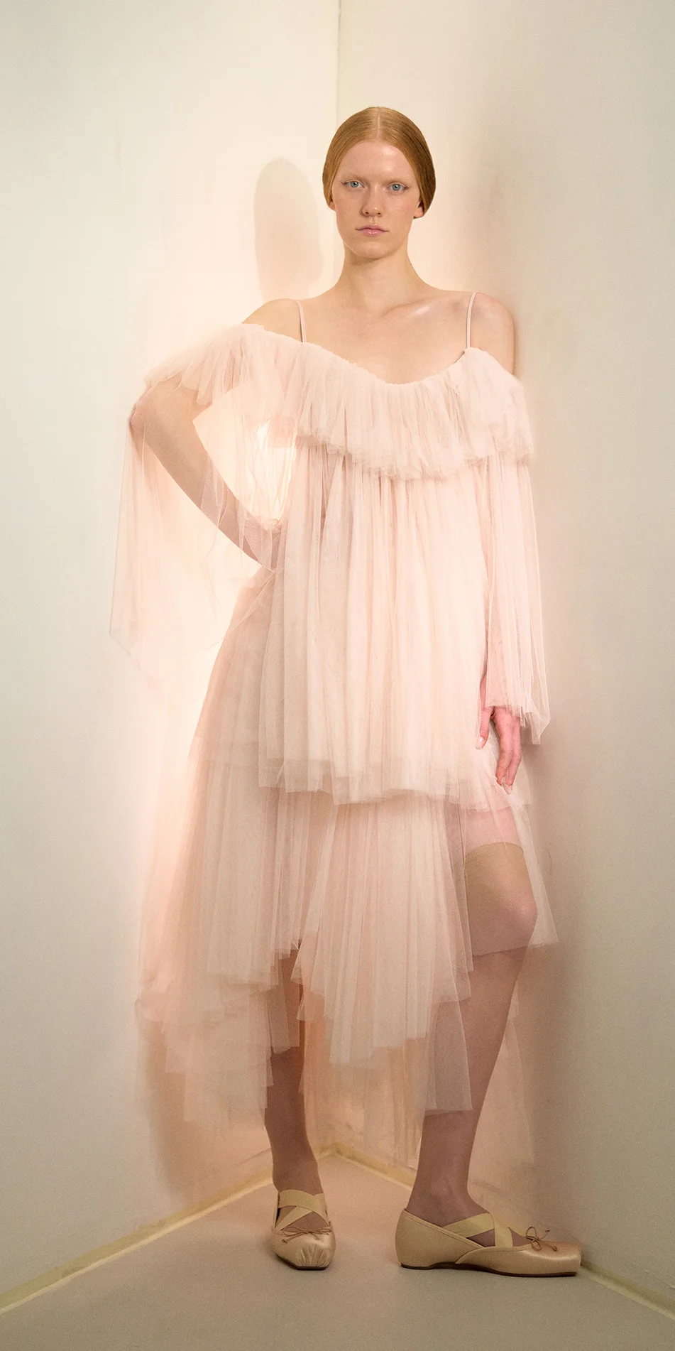 Tulle babydoll dress angel sleeves in soft pink front posing on