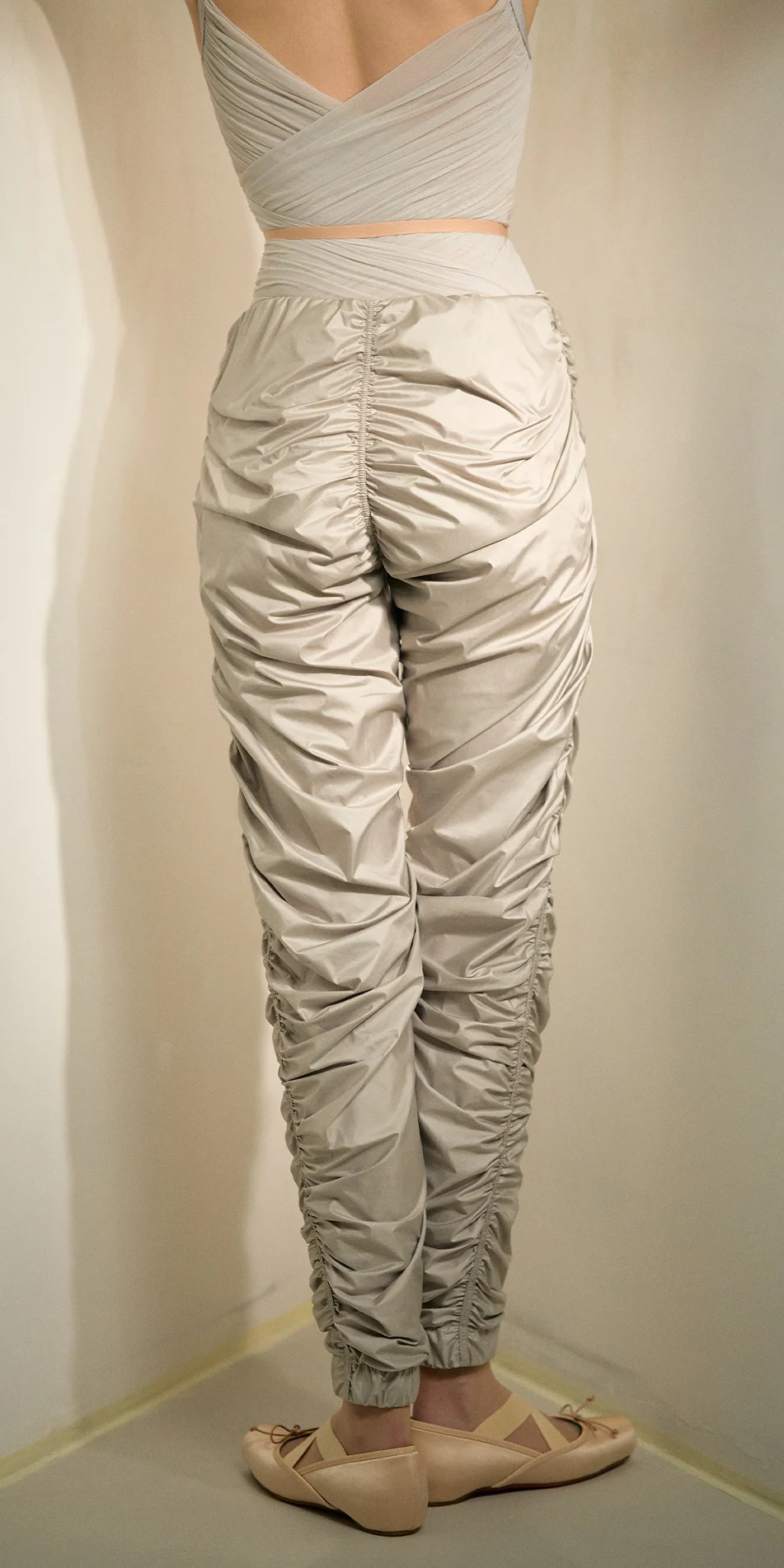 Women's draped track pants in sage green back view