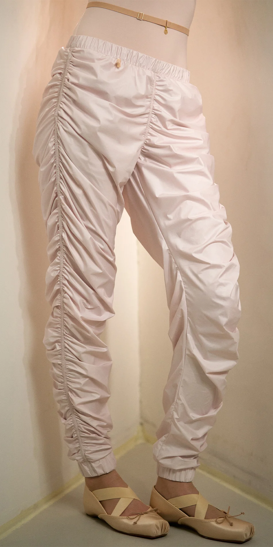 Womens draped track pants in soft pink legs cropped shot