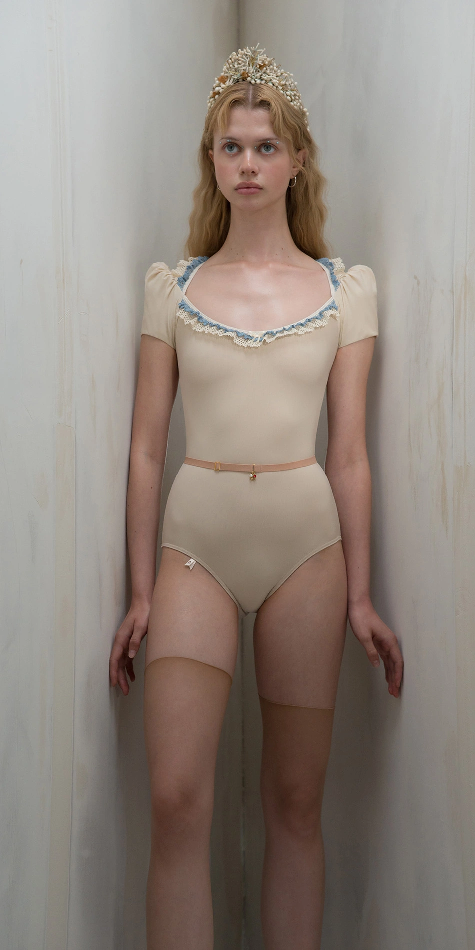 Lace leotard with puff sleeves in creamlight blue front on