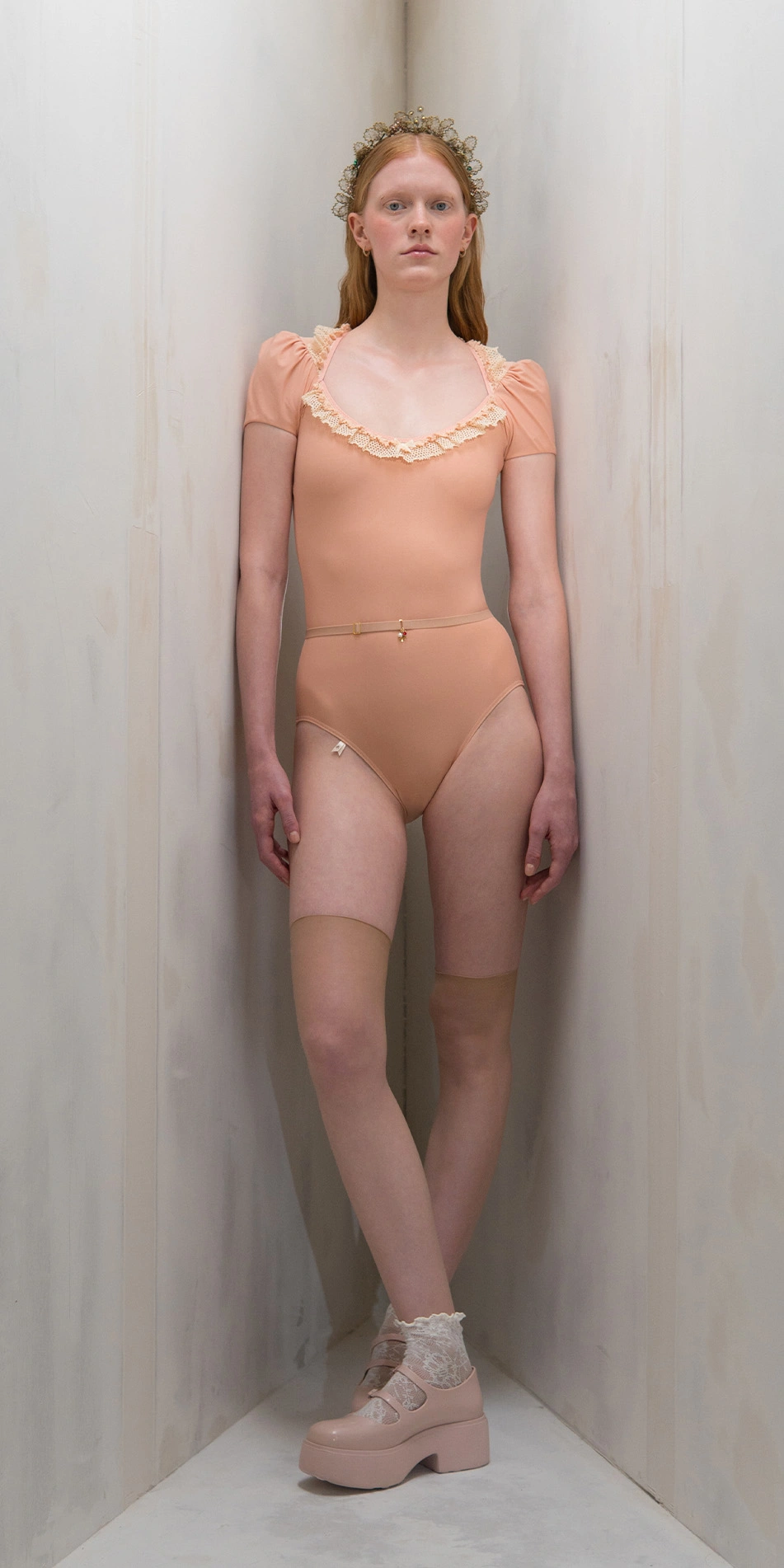 Lace leotard with puff sleeves in light orange full body on