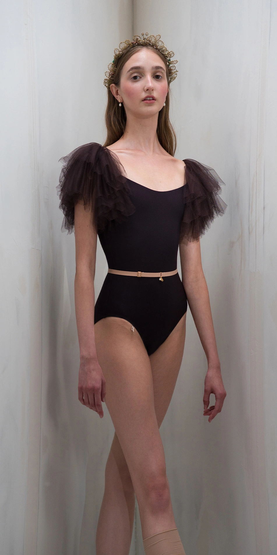 Leotard with tulle sleeves in dark purple front cropped legs crossed