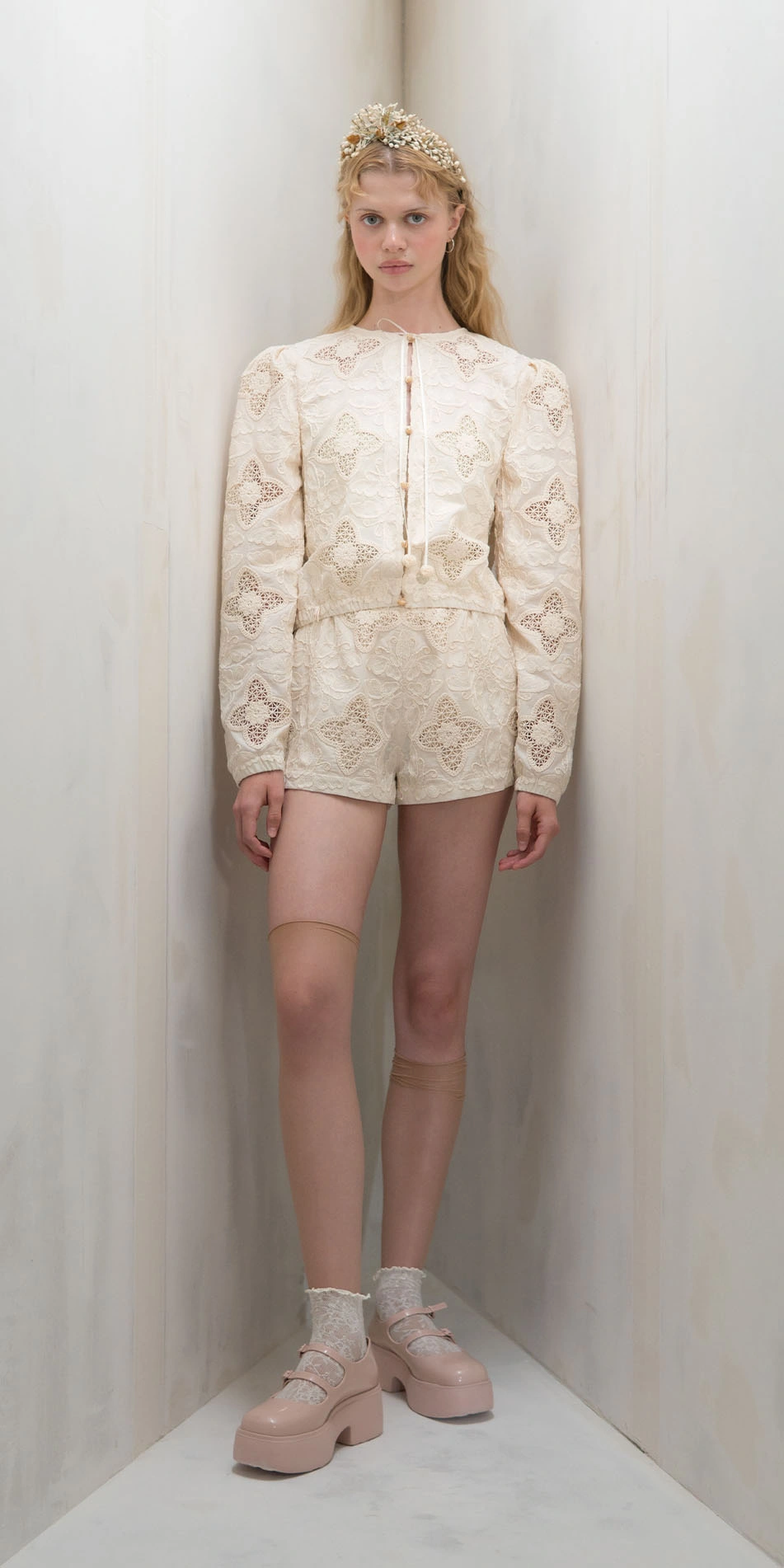 Round neck embroidered cotton jacket in cream front view