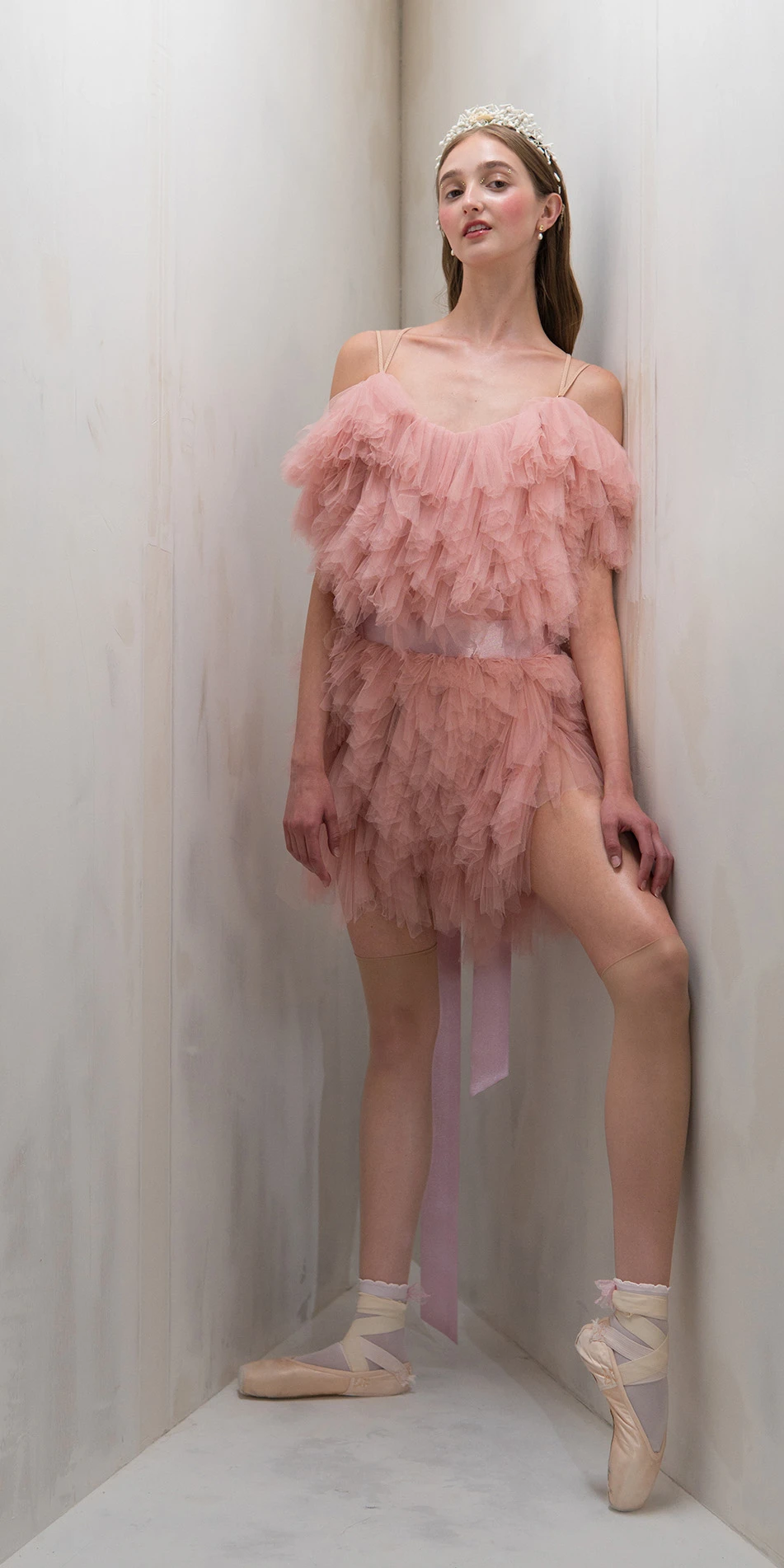 Tulle mini dress spiral ruffles in dusty pink front leg lifted