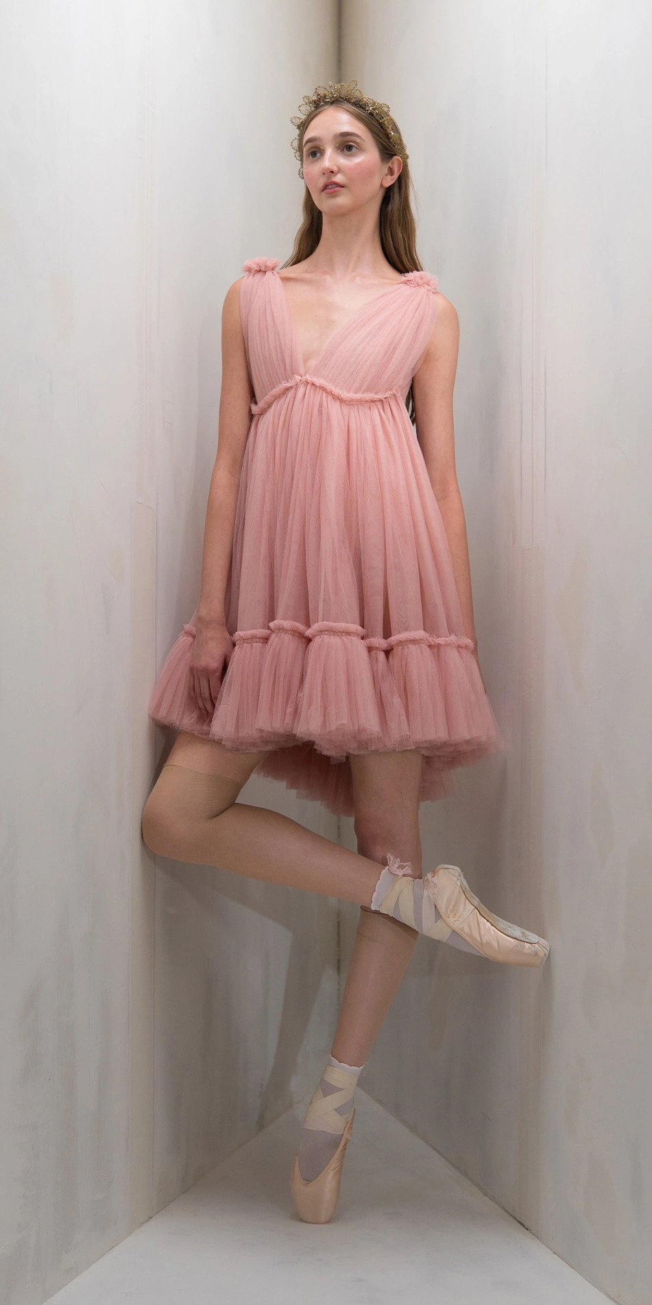 Tulle split neck babydoll dress in dusty pink front leg crossed