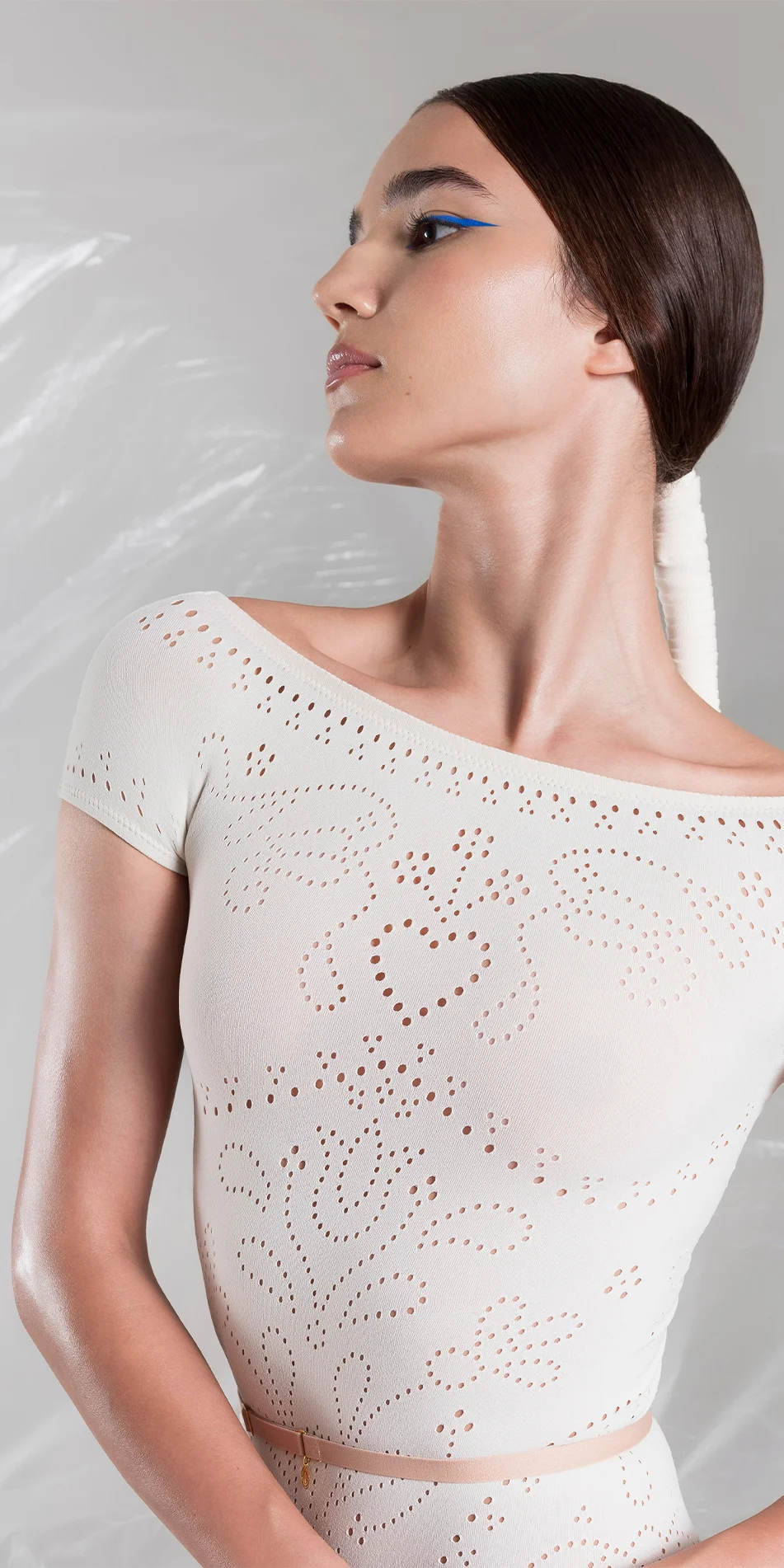 Seamless off shoulder knitted leotard in cream front close up arms down