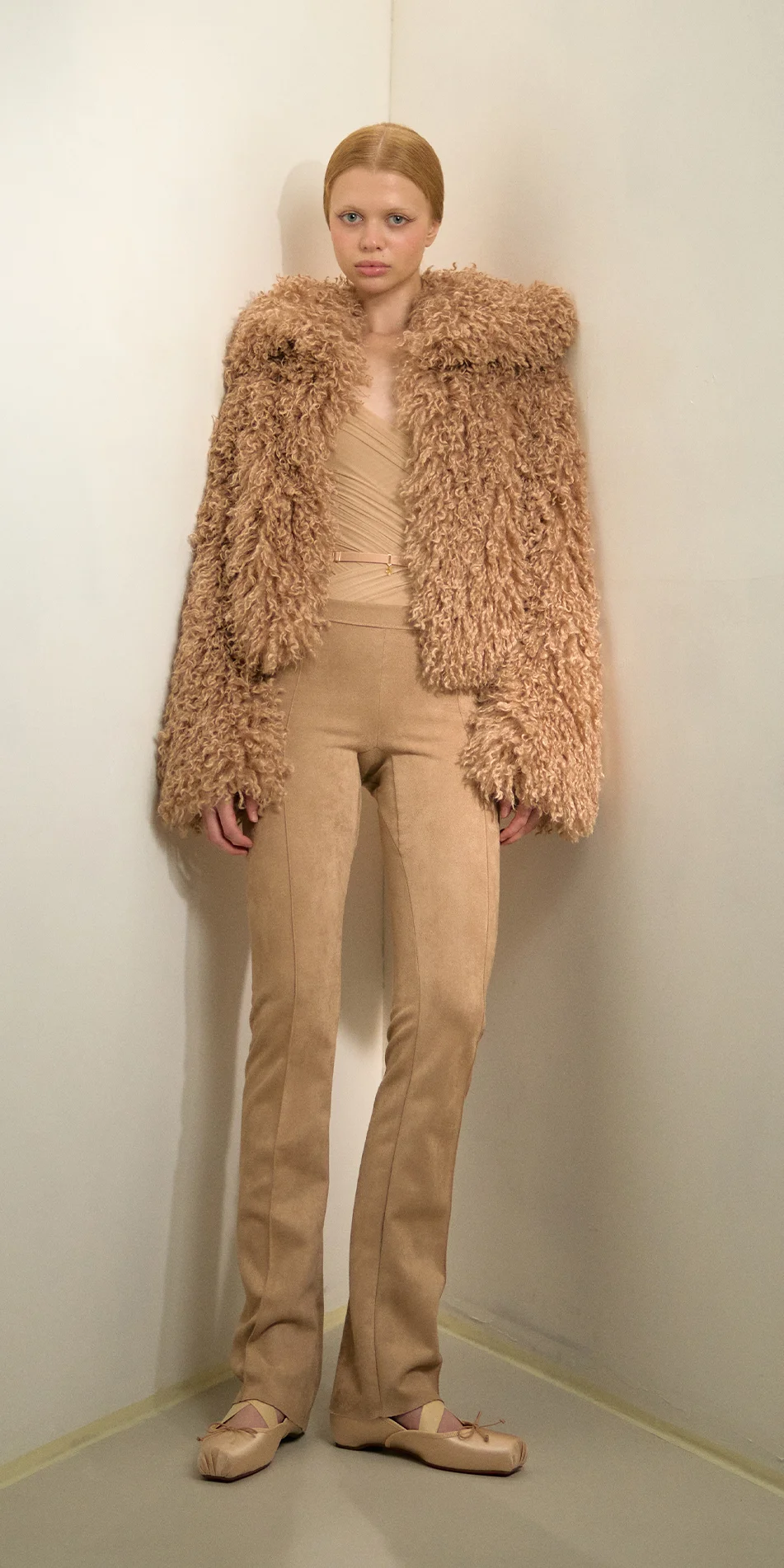 Faux fur jacket nude front view leaning side