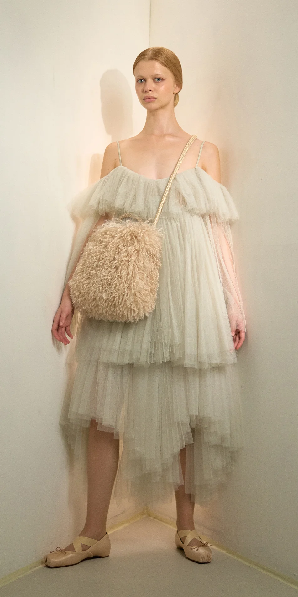 Faux fur muff crossbody bag light beige front view arms down