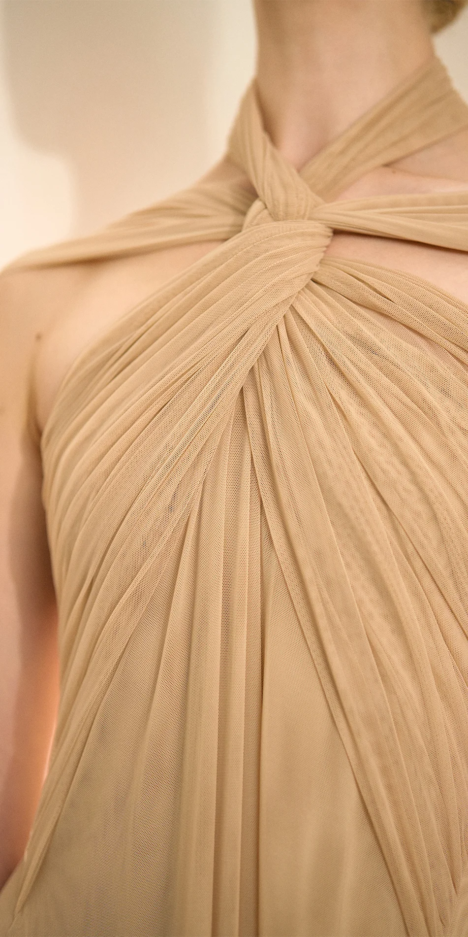 Knotted halter maxi dress in light beige close up of front knotted neckline detail