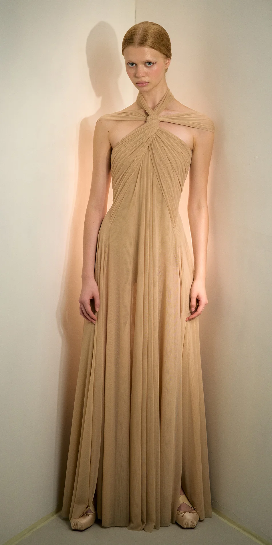 Knotted halter maxi dress in light beige full shot with model gaze