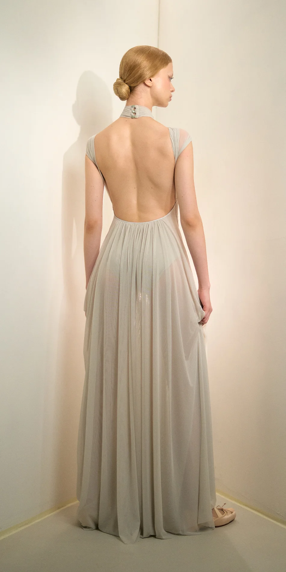 Knotted halter maxi dress in sage green back view