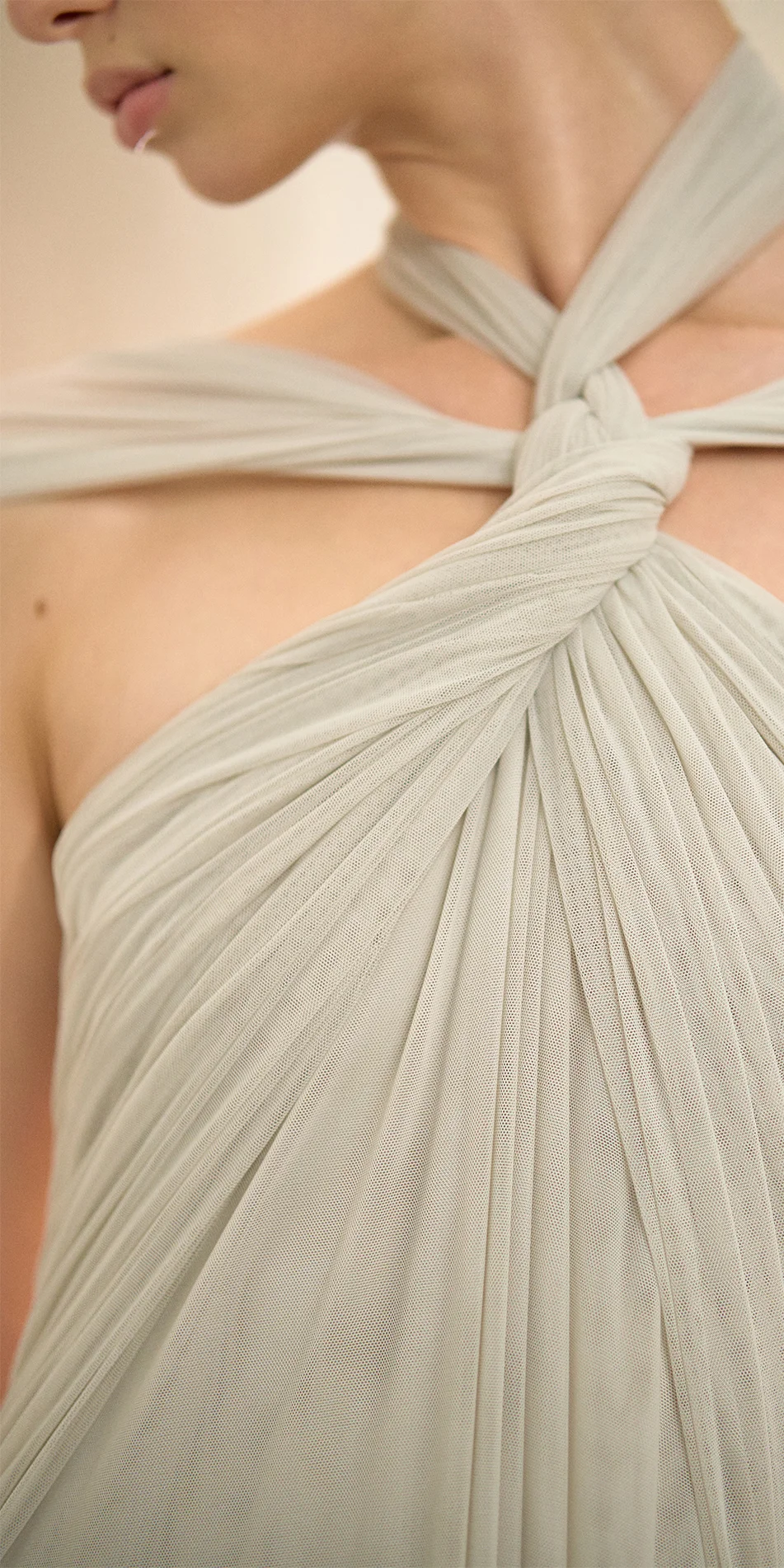 Knotted halter maxi dress in sage green close up of knotted neckline detail