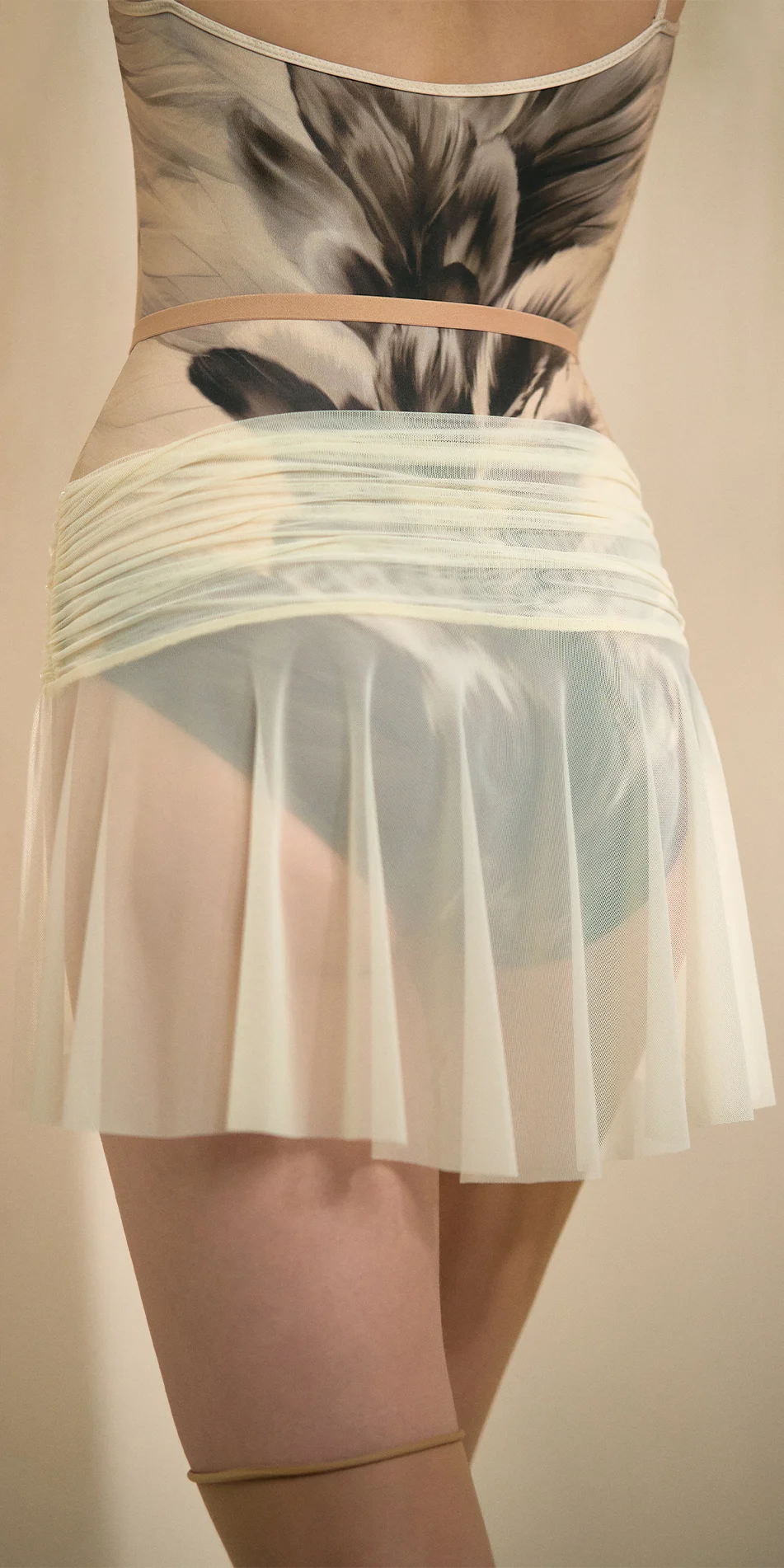 Mesh mini skirt in cream back torso with draped lines