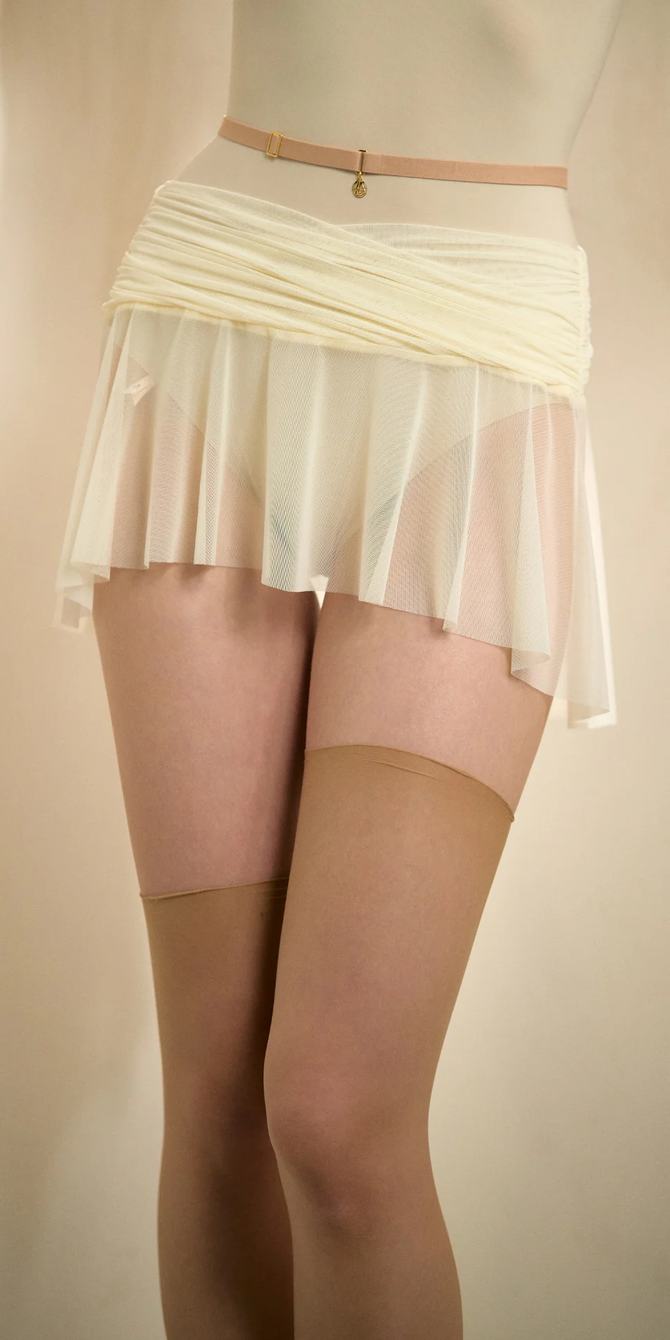 Mesh mini skirt in cream front close up