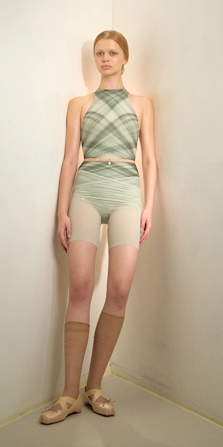 Sheer bike shorts in sage green full shot model standing light on