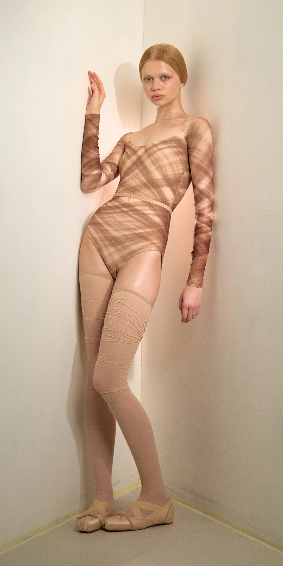 Sheer thigh high stockings in light beige front posing on