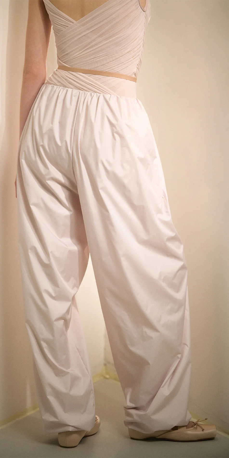 Women's lightweight baggy pants in soft pink back view