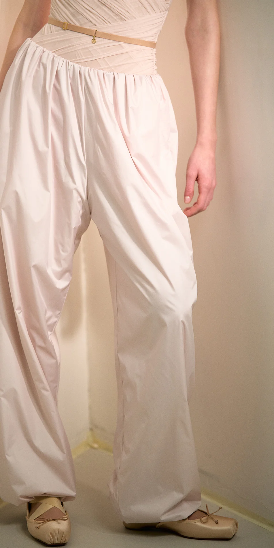Women's lightweight baggy pants in soft pink front close up