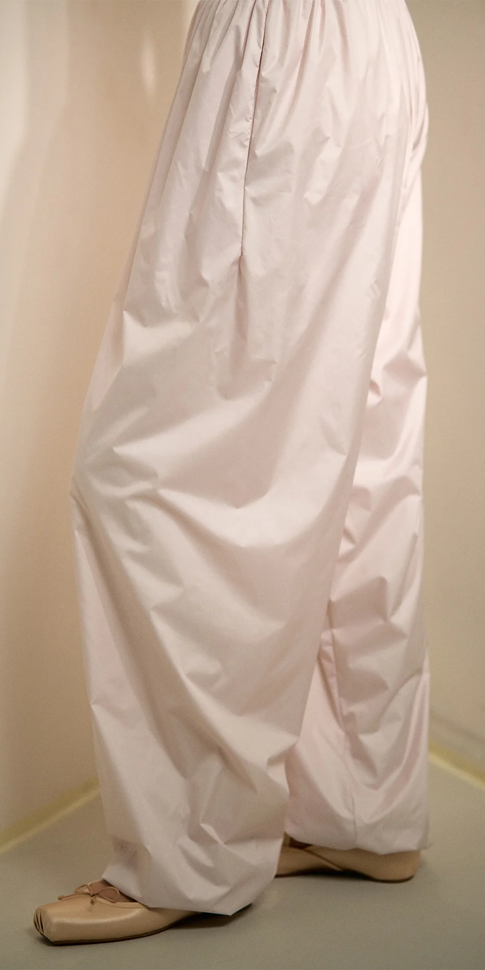 Women's lightweight baggy pants in soft pink side close up