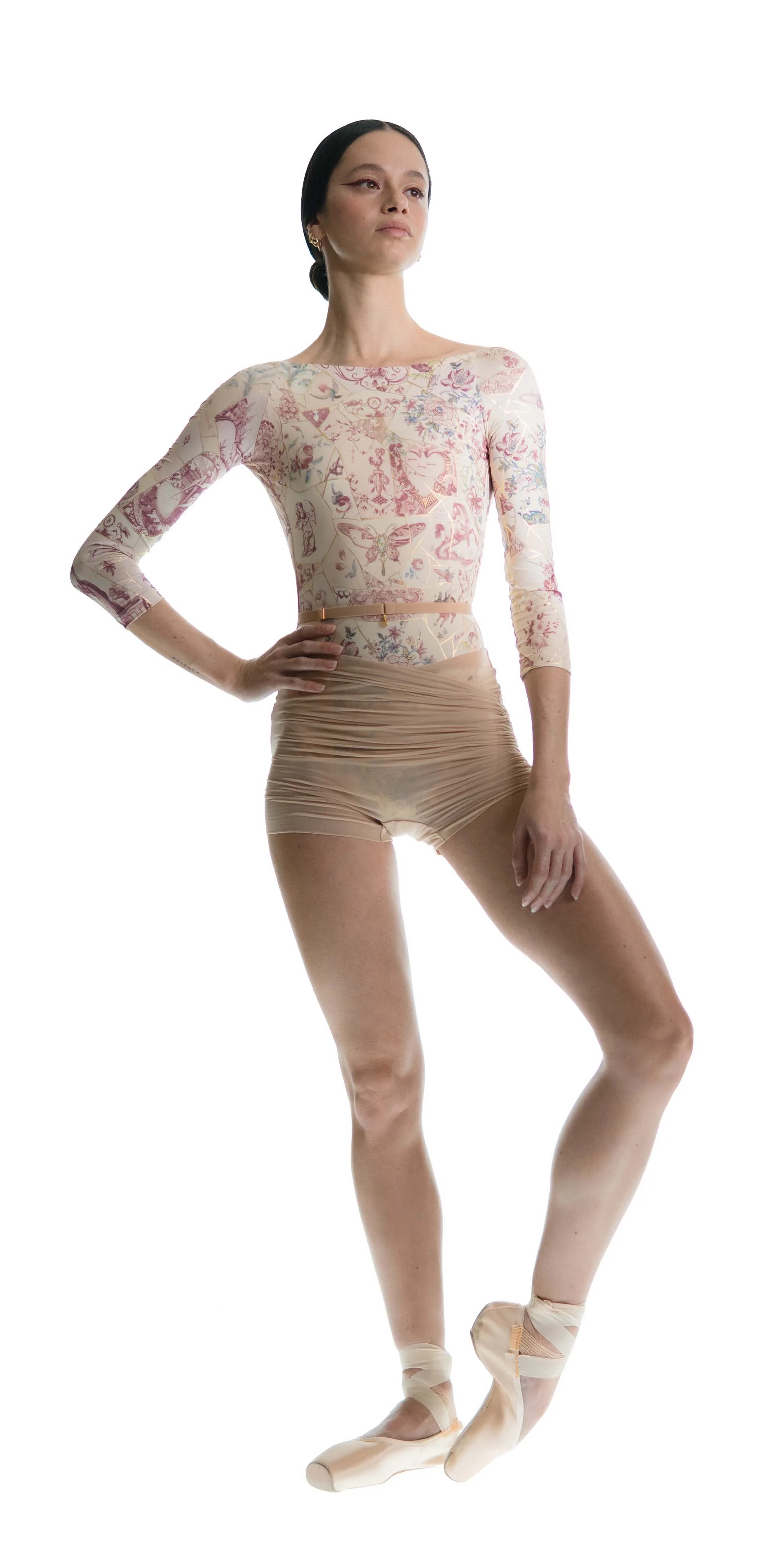 Sheer wrap shorts in light beige front arm on hip