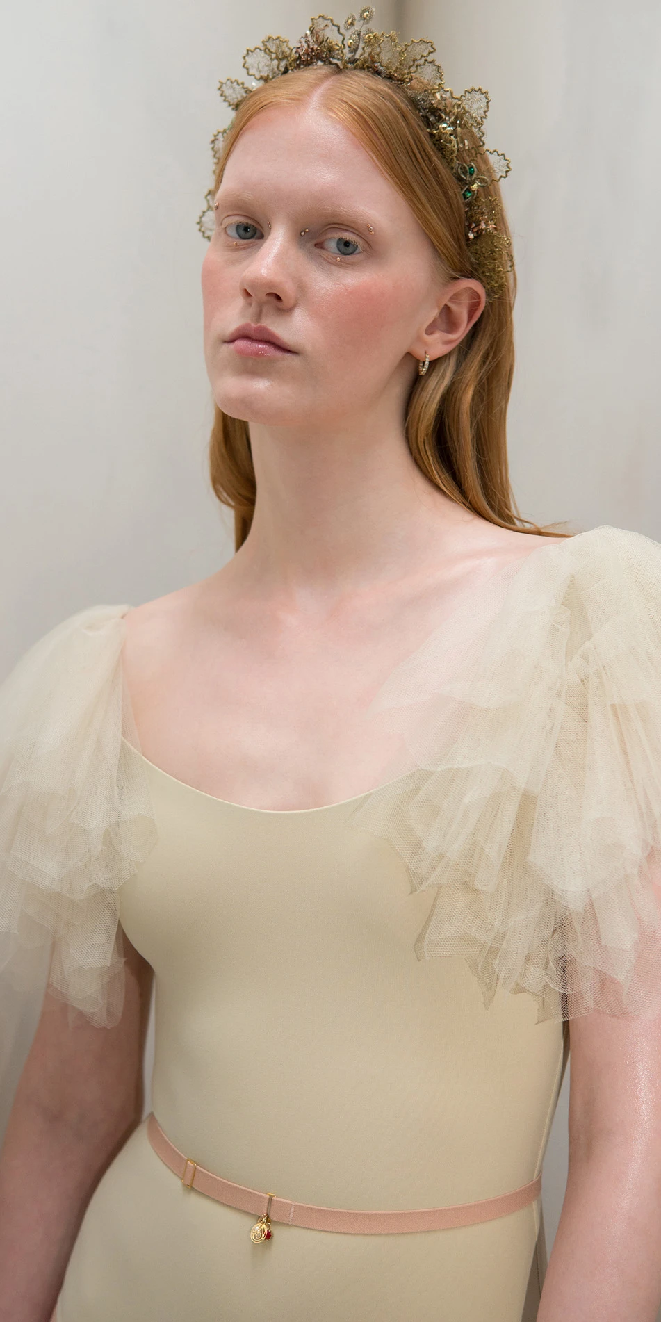 Leotard with tulle sleeves in beige front