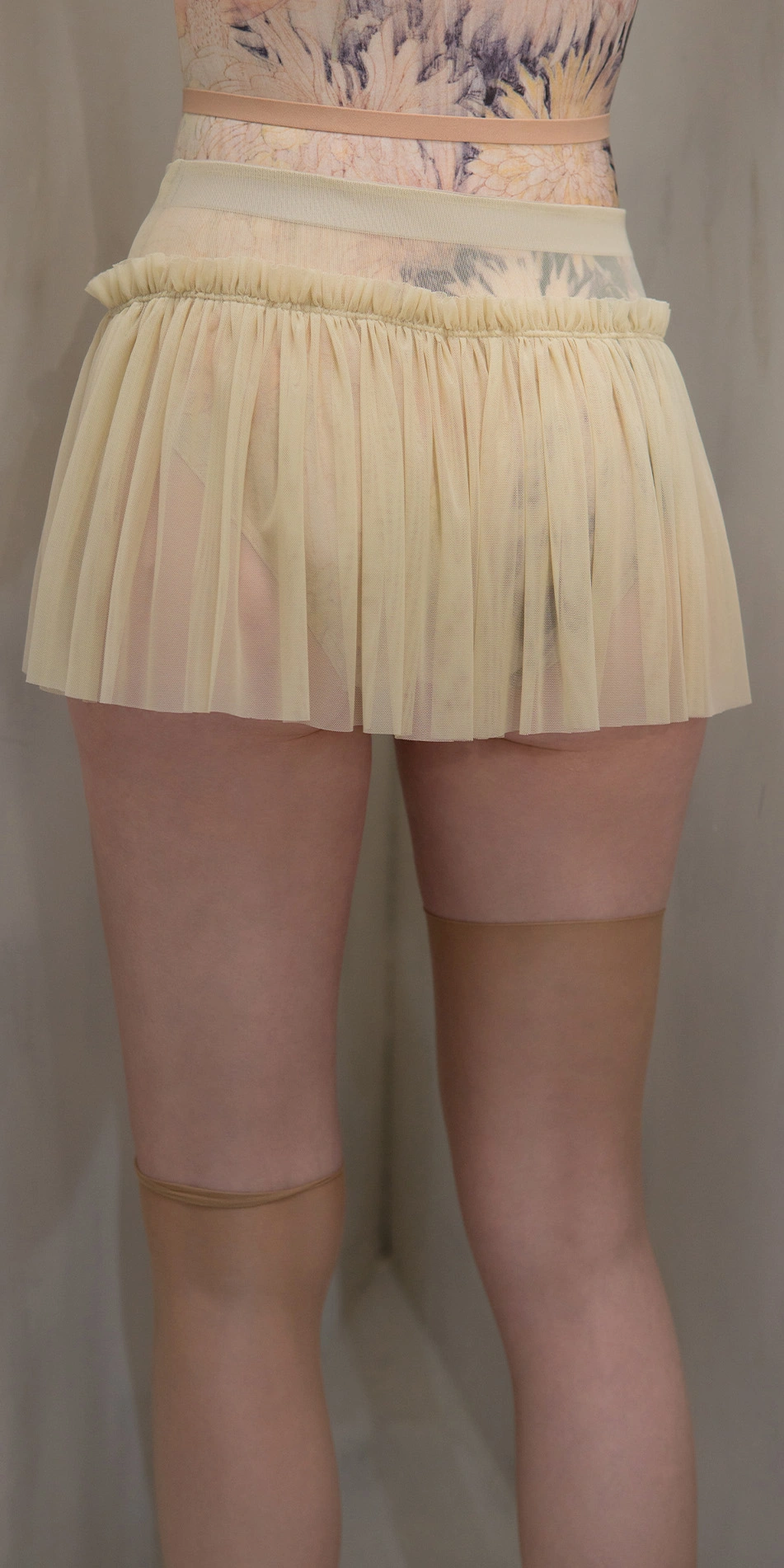 Sheer ruched ruffle mini skirt in beige close up back